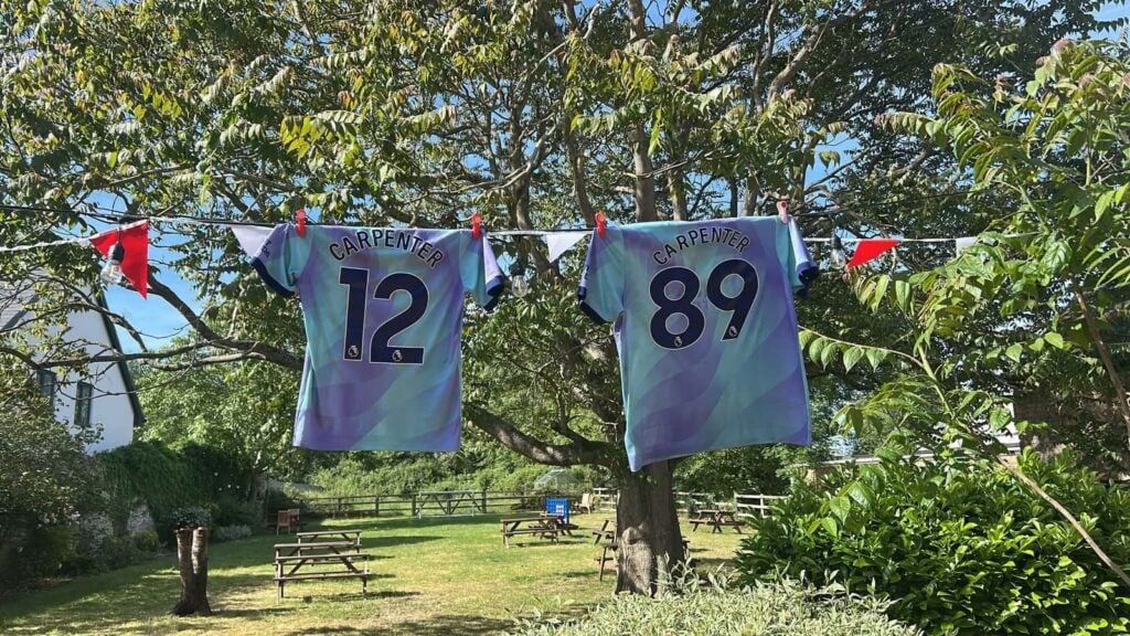 Football shirts hanging from the bunting in the beer garden