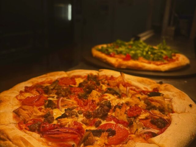Two sourdough pizzas fresh from the oven